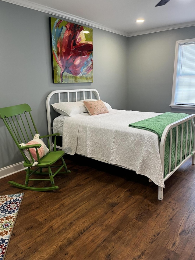 bedroom featuring recessed lighting, baseboards, wood finished floors, and crown molding