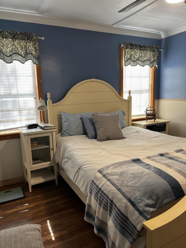 bedroom featuring crown molding and wood-type flooring