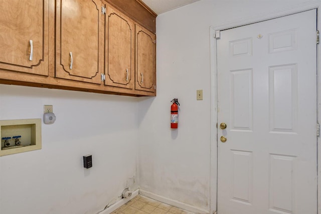 washroom featuring cabinets and washer hookup