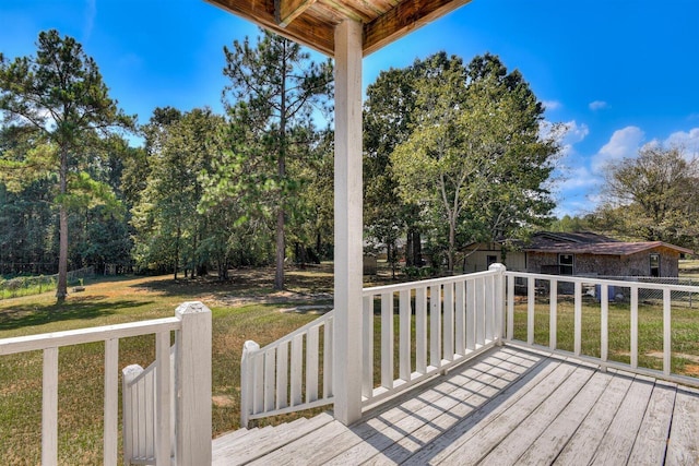 wooden deck with a yard