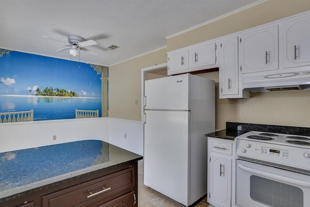 kitchen featuring stove, white refrigerator, white cabinetry, and dark brown cabinetry