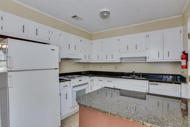 kitchen featuring a textured ceiling, sink, white cabinets, and white appliances