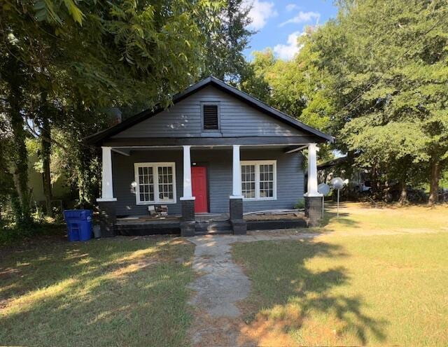 view of front of house featuring a front lawn and a porch