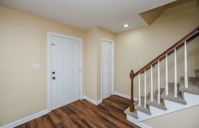 entrance foyer featuring dark hardwood / wood-style flooring