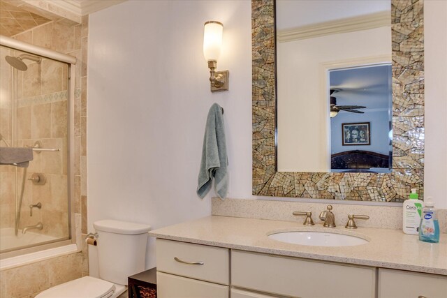 710 Somerset Way, Augusta, GA 30909 - ensuite bathroom with ornamental molding, tiled shower / bath combo, vanity, and ceiling fan