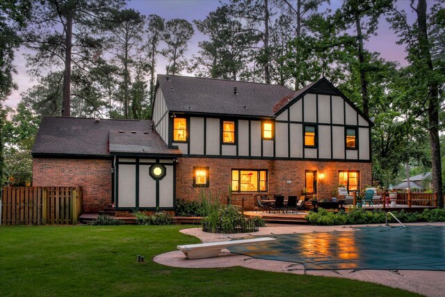 710 Somerset Way, Augusta, GA 30909 - rear view of property featuring a deck, brick siding, board and batten siding, and a shingled roof