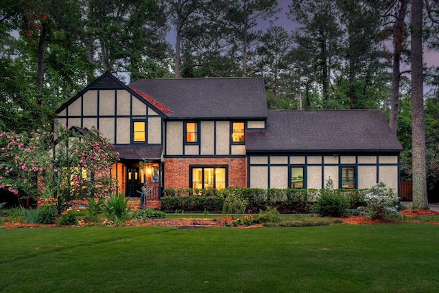 710 Somerset Way, Augusta, GA 30909 - view of front of home with a front lawn, stucco siding, and roof with shingles