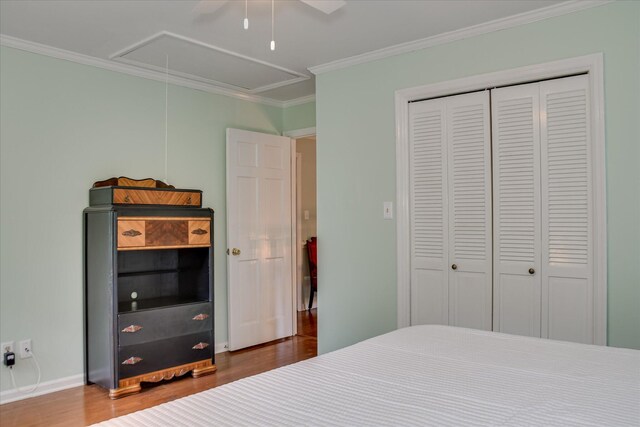 710 Somerset Way, Augusta, GA 30909 - bedroom featuring attic access, wood finished floors, crown molding, a closet, and ceiling fan