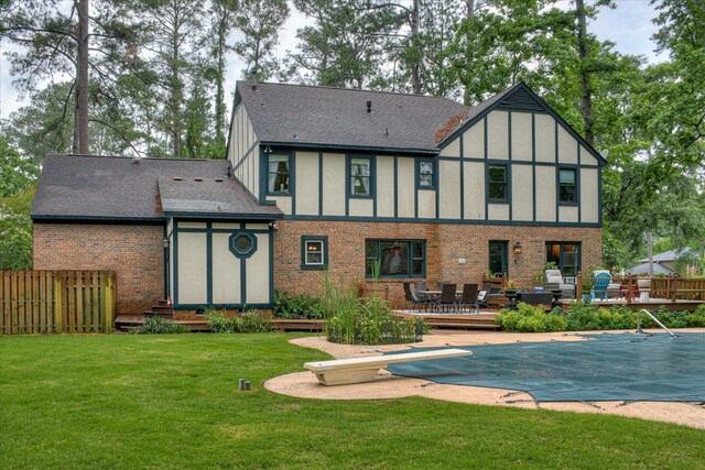 710 Somerset Way, Augusta, GA 30909 - rear view of property featuring a shingled roof, brick siding, a wooden deck, and entry steps