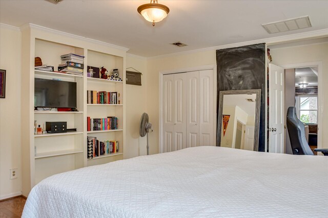 710 Somerset Way, Augusta, GA 30909 - bedroom with ornamental molding, a closet, and wood finished floors