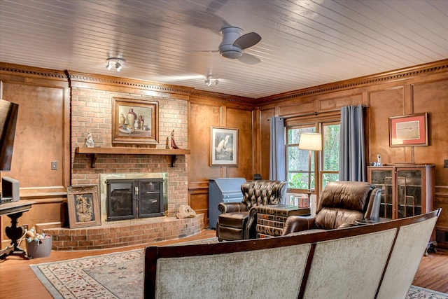 710 Somerset Way, Augusta, GA 30909 - living area featuring wood finished floors, a brick fireplace, a ceiling fan, wooden walls, and crown molding