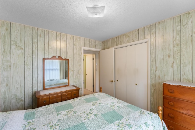 unfurnished bedroom featuring a closet and a textured ceiling