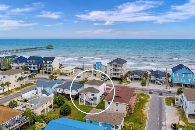 bird's eye view featuring a water view and a residential view