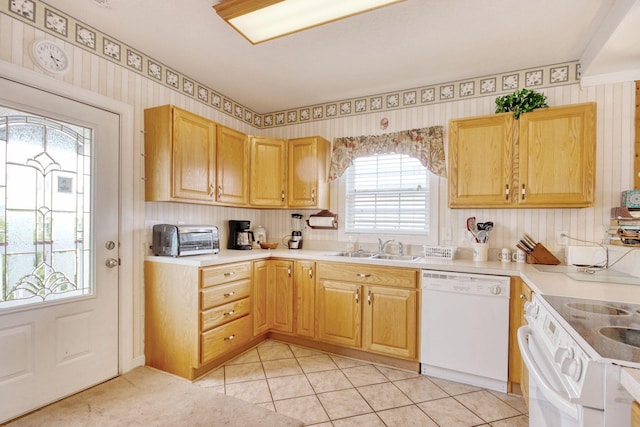 kitchen with a sink, dishwasher, electric stove, wallpapered walls, and a toaster