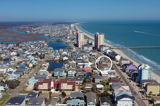 bird's eye view featuring a beach view and a water view
