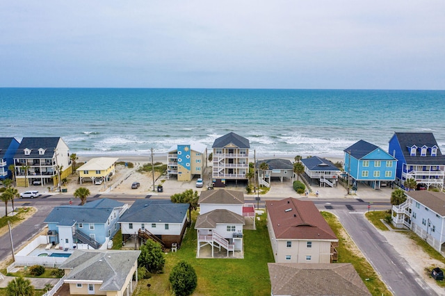 bird's eye view featuring a residential view and a water view