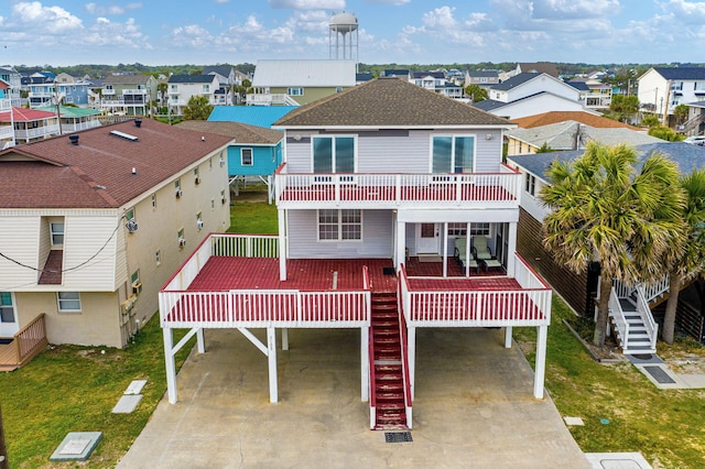 view of front of house featuring a residential view, a carport, and stairway