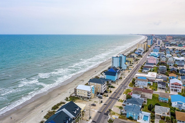aerial view with a view of the beach and a water view