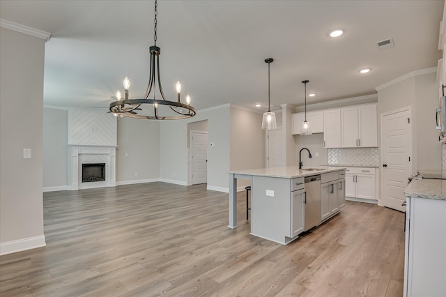 5265 Greyton Cir, North Augusta, SC 29860 - kitchen featuring a sink, dishwasher, crown molding, decorative backsplash, and white cabinets