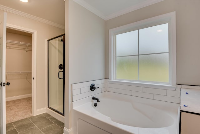 5265 Greyton Cir, North Augusta, SC 29860 - bathroom with a garden tub, a stall shower, a spacious closet, ornamental molding, and baseboards