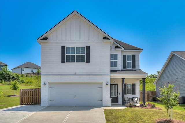 5265 Greyton Cir, North Augusta, SC 29860 - traditional home featuring a garage, a porch, board and batten siding, driveway, and roof with shingles