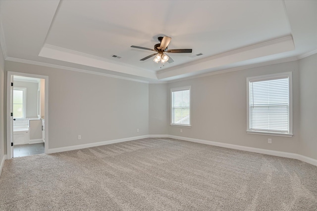 5265 Greyton Cir, North Augusta, SC 29860 - carpeted spare room featuring a tray ceiling, ornamental molding, a ceiling fan, and baseboards