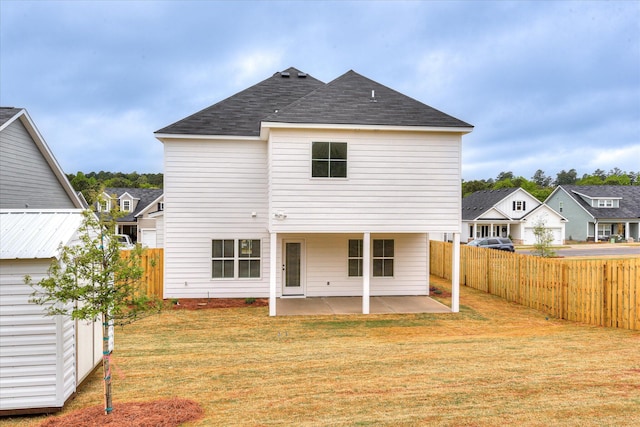 5265 Greyton Cir, North Augusta, SC 29860 - back of property featuring a patio area, roof with shingles, and a residential view