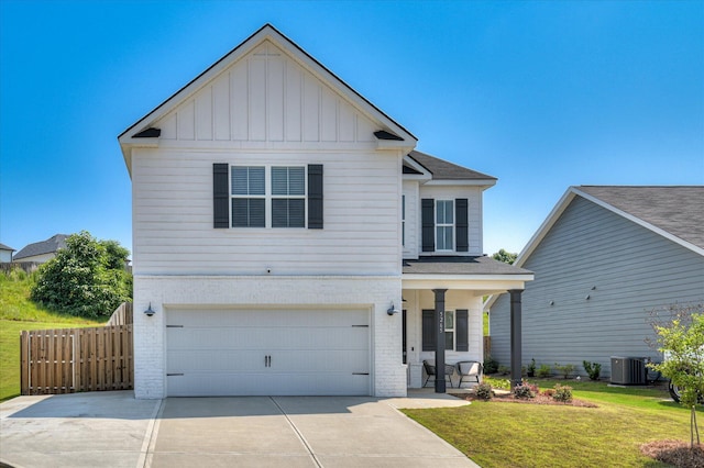 5265 Greyton Cir, North Augusta, SC 29860 - traditional-style house with board and batten siding, brick siding, an attached garage, concrete driveway, and covered porch