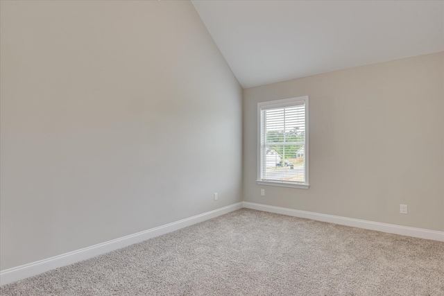 5265 Greyton Cir, North Augusta, SC 29860 - empty room featuring vaulted ceiling, baseboards, and light carpet