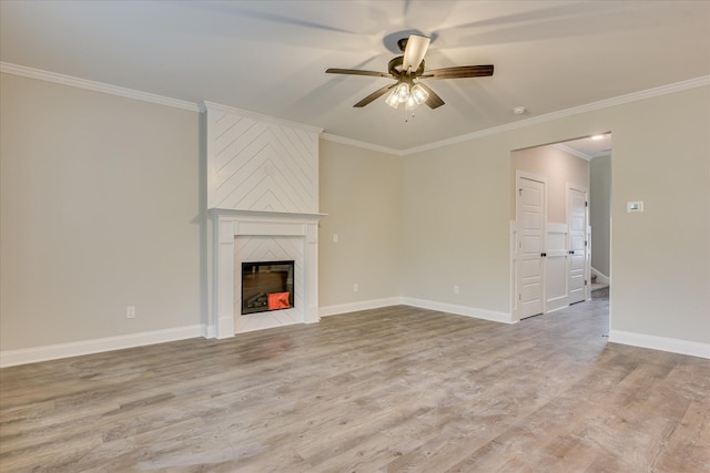 5265 Greyton Cir, North Augusta, SC 29860 - unfurnished living room featuring ceiling fan, light wood-type flooring, crown molding, a large fireplace, and baseboards