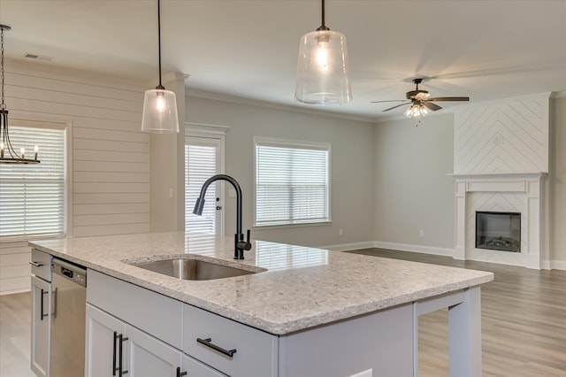 5265 Greyton Cir, North Augusta, SC 29860 - kitchen with a sink, stainless steel dishwasher, open floor plan, an island with sink, and light wood-style floors