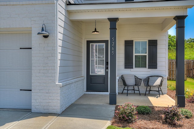 5265 Greyton Cir, North Augusta, SC 29860 - view of exterior entry with a porch and brick siding