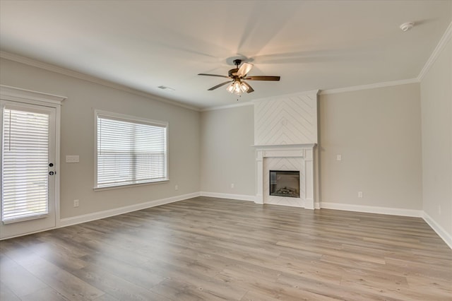 5265 Greyton Cir, North Augusta, SC 29860 - unfurnished living room with a ceiling fan, healthy amount of natural light, wood finished floors, crown molding, and a large fireplace