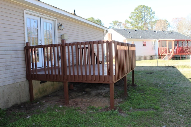 wooden terrace with a yard