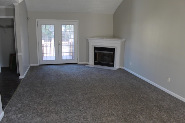 unfurnished living room featuring french doors and baseboards