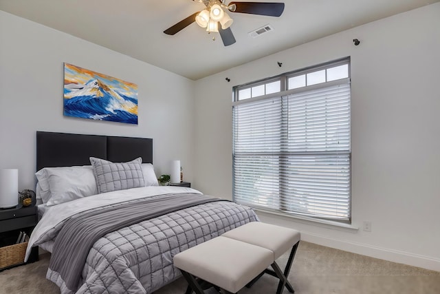 bedroom featuring ceiling fan and carpet