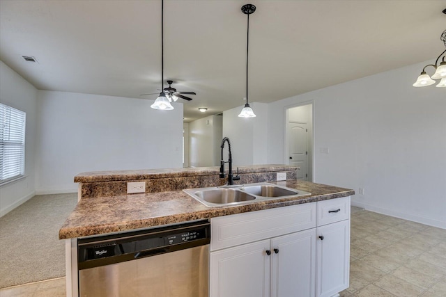 kitchen with sink, hanging light fixtures, stainless steel dishwasher, a kitchen island with sink, and white cabinets