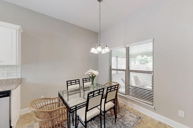 dining space featuring baseboards, a chandelier, and light tile patterned flooring