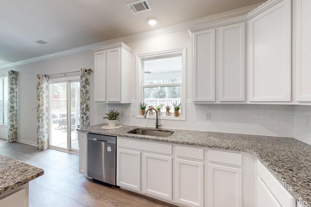 6134 High Top Ln, Aiken, SC 29801 - kitchen featuring dishwasher, a sink, white cabinets, decorative backsplash, and crown molding