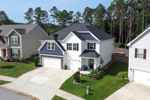 6134 High Top Ln, Aiken, SC 29801 - craftsman house featuring stone siding, concrete driveway, a garage, a front yard, and a shingled roof