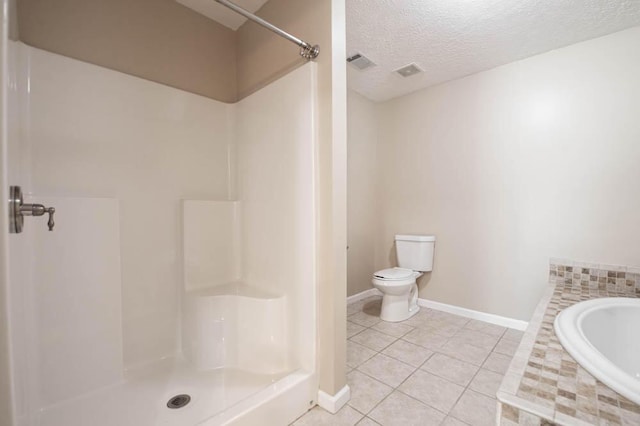 bathroom featuring tile patterned floors, toilet, a textured ceiling, and walk in shower