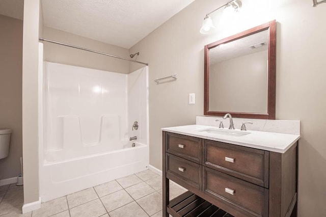 full bathroom with toilet, tile patterned floors, bathtub / shower combination, and vanity