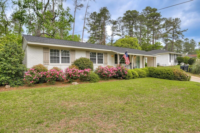 single story home with a front yard