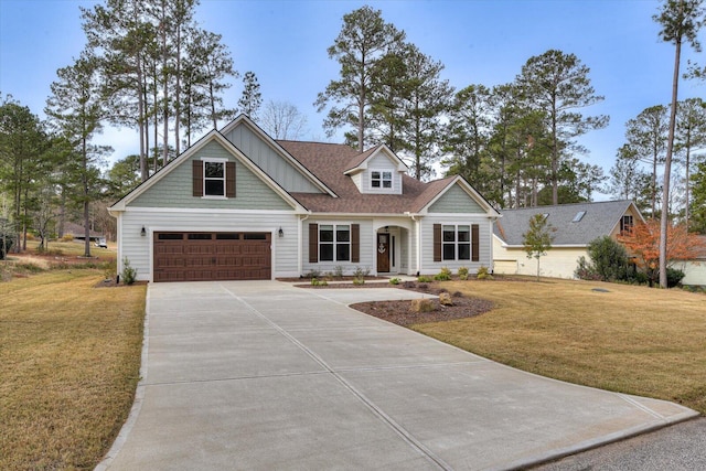 view of front of house featuring a front lawn and a garage