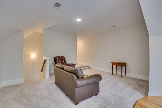 living room with lofted ceiling and light carpet