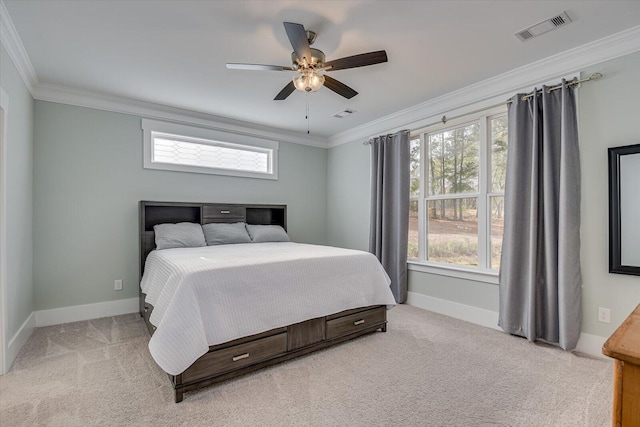 bedroom featuring light colored carpet, ceiling fan, and crown molding