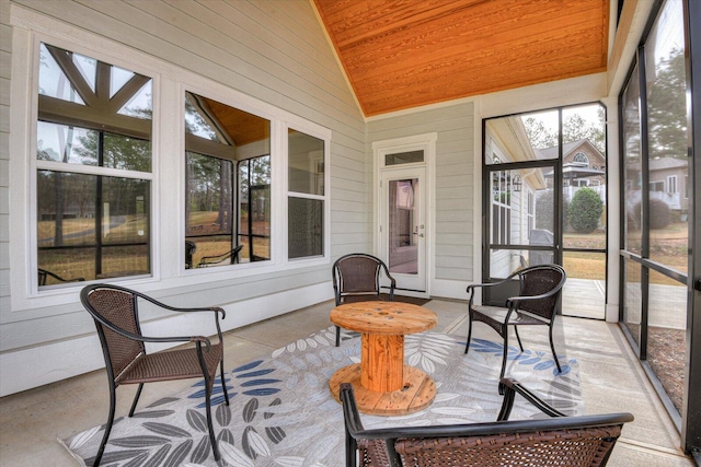 sunroom with wood ceiling and vaulted ceiling