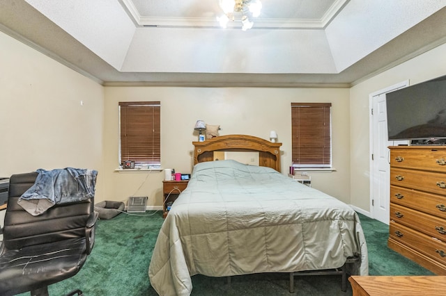 bedroom with a raised ceiling, dark carpet, crown molding, and baseboards