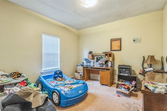 bedroom featuring light carpet and a textured ceiling