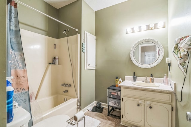 bathroom with shower / bath combo with shower curtain, vanity, tile patterned floors, baseboards, and toilet